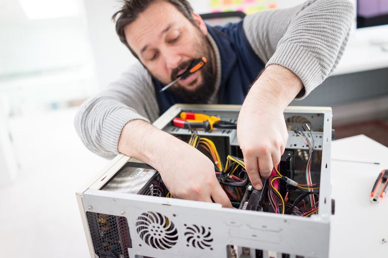 technician repairing computer